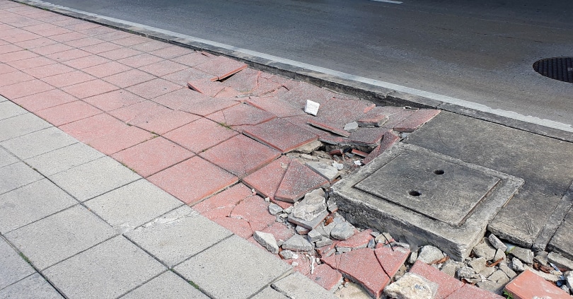 dangerous cracked sidewalk