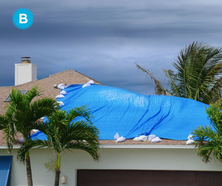 house in Florida with blue tarp on roof after hurricane damage