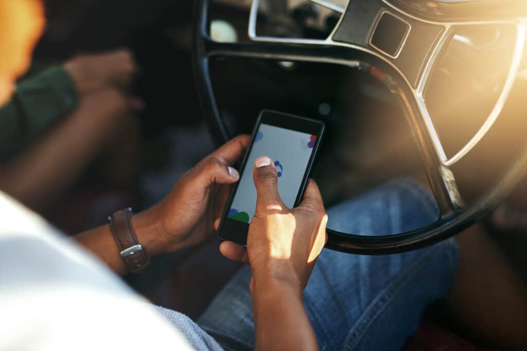 image of woman texting while driving in Florida; distracted driving concept