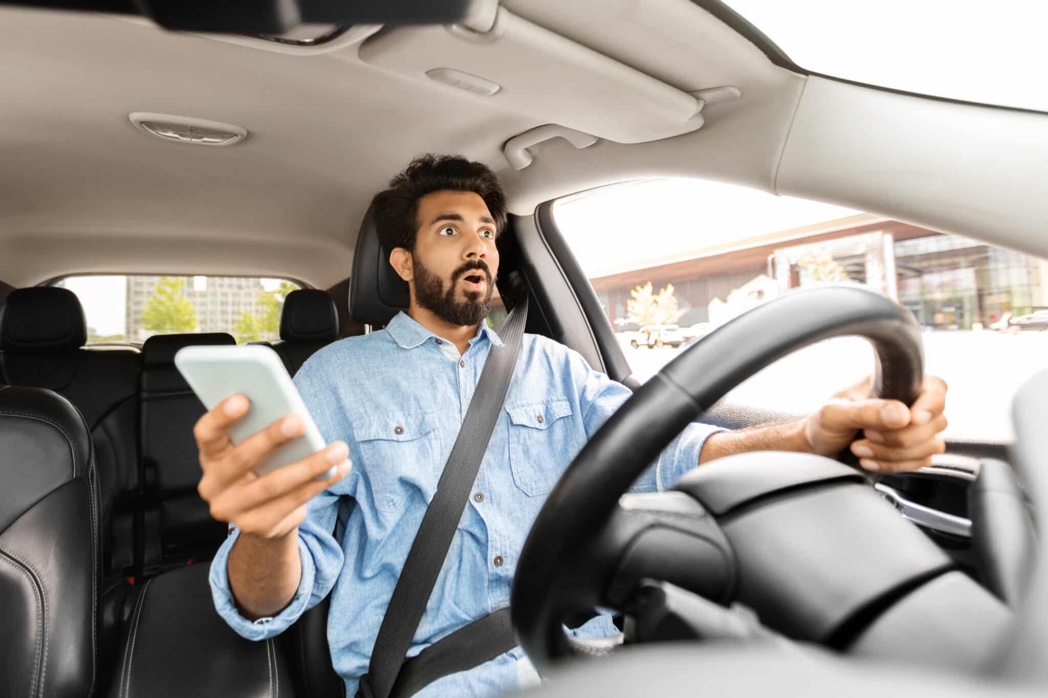 image of shocked distracted driver after texting while driving